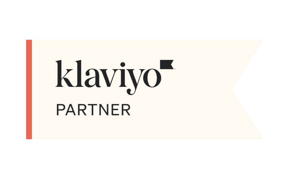 Klaviyo Partner badge on a cream ribbon with an orange left edge